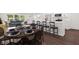 Open floor plan with dining area featuring a kitchen island and modern finishes at 5843 N Oakland Ave, Indianapolis, IN 46220