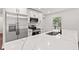 Bright kitchen with a large white quartz island and stainless steel appliances at 5843 N Oakland Ave, Indianapolis, IN 46220