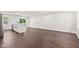 Spacious living area featuring wood-look floors, fresh paint, and an open layout at 5843 N Oakland Ave, Indianapolis, IN 46220