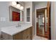 Modern bathroom features a sleek vanity with a bright mirror and a doorway at 5941 North St, Stilesville, IN 46180