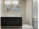 Bathroom featuring a double sink vanity with marble countertop and modern fixtures at 5941 North St, Stilesville, IN 46180