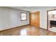 Bright bedroom with hardwood floors, a window for natural light, and closet space, adjacent to a bathroom at 5941 North St, Stilesville, IN 46180