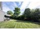 Spacious, well-maintained backyard with a patio and lush greenery offers a private outdoor retreat at 635 Sonoma Ln, Greenfield, IN 46140