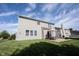 Exterior view showcasing the home's backyard, patio, and well-maintained lawn, creating a serene outdoor space at 635 Sonoma Ln, Greenfield, IN 46140