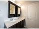 Bright bathroom featuring double sinks, storage cabinet, and modern fixtures at 635 Sonoma Ln, Greenfield, IN 46140
