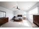A bright bedroom features vaulted ceilings, neutral decor, and natural light from the large windows at 635 Sonoma Ln, Greenfield, IN 46140