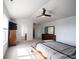 Neutral bedroom featuring a bed with neutral tones, vaulted ceilings, and access to the bathroom at 635 Sonoma Ln, Greenfield, IN 46140