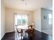 Sun-filled dining area with hardwood floors and backyard views at 635 Sonoma Ln, Greenfield, IN 46140