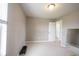 Exercise room featuring neutral carpeting and free weights with access to another room through a white door at 635 Sonoma Ln, Greenfield, IN 46140