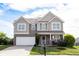 Beautiful two-story home with a well-manicured lawn and attached two car garage at 635 Sonoma Ln, Greenfield, IN 46140