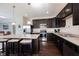 Well-lit kitchen with stainless steel appliances, center island with seating, and ample counter space at 635 Sonoma Ln, Greenfield, IN 46140