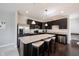 Modern kitchen with stainless steel appliances, granite countertops, and a breakfast bar at 635 Sonoma Ln, Greenfield, IN 46140