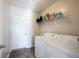 Functional laundry room includes appliances and shelving for storage at 635 Sonoma Ln, Greenfield, IN 46140
