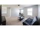 Comfortable living room with neutral carpet, a ceiling fan, and ample natural light at 635 Sonoma Ln, Greenfield, IN 46140