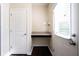 Bright mud room features a built-in desk and a door to the exterior at 635 Sonoma Ln, Greenfield, IN 46140