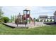 Community playground featuring a slide and climbing structure provides a safe play area at 635 Sonoma Ln, Greenfield, IN 46140