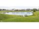 Community pond in the neighborhood providing a serene view at 635 Sonoma Ln, Greenfield, IN 46140
