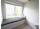 Cozy window seat offers natural light and comfortable cushions at 635 Sonoma Ln, Greenfield, IN 46140
