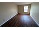Clean and bright bedroom with wood flooring and light neutral walls at 6715 Shanghai Cir, Indianapolis, IN 46278