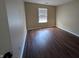 Cozy bedroom featuring modern floors and a sunlit window at 6715 Shanghai Cir, Indianapolis, IN 46278