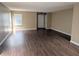 Spacious living room with wood floors, neutral walls, and a bright window at 6715 Shanghai Cir, Indianapolis, IN 46278