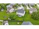 Aerial view of a home's backyard with a patio, shed, and a fenced yard at 6822 Woodford Ln, Indianapolis, IN 46237