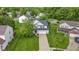 Charming two-story home with a lush green lawn, a long driveway, and curb appeal at 6822 Woodford Ln, Indianapolis, IN 46237