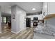 Bright kitchen featuring stainless steel appliances, granite countertops, and white cabinetry at 6822 Woodford Ln, Indianapolis, IN 46237