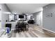 Open living space with fireplace, built-in shelving, and comfortable seating at 6822 Woodford Ln, Indianapolis, IN 46237
