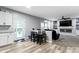 Open-concept living space connecting the kitchen, dining area, and living room at 6822 Woodford Ln, Indianapolis, IN 46237