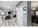 Open living space featuring a dining area, living room with fireplace, and modern gray walls at 6822 Woodford Ln, Indianapolis, IN 46237