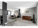 Spacious main bedroom features neutral walls, soft carpet, and a large bed frame at 6822 Woodford Ln, Indianapolis, IN 46237