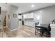 Spacious kitchen, dining, and living area, featuring an open concept design at 6822 Woodford Ln, Indianapolis, IN 46237