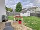 Backyard with a patio, lawn, shed, and playhouse at 6824 W Philadelphia Dr, McCordsville, IN 46055