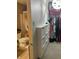 Bathroom with closet, with decorative shower curtain, toilet, and storage unit at 6824 W Philadelphia Dr, McCordsville, IN 46055