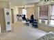 A large room functions as a bedroom and office, equipped with multiple workstations at 6824 W Philadelphia Dr, McCordsville, IN 46055