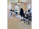 Bedroom also configured as a home office featuring multiple workstations and comfortable chairs at 6824 W Philadelphia Dr, McCordsville, IN 46055