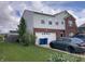 Two-story home with a brick and vinyl exterior, featuring an attached garage and a well-maintained lawn with landscaping at 6824 W Philadelphia Dr, McCordsville, IN 46055