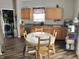 A lovely kitchen with stainless steel appliances and a dining area featuring a round table at 6824 W Philadelphia Dr, McCordsville, IN 46055
