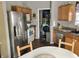 A well-lit kitchen boasts stainless steel appliances and light wood cabinets at 6824 W Philadelphia Dr, McCordsville, IN 46055