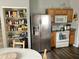 The kitchen features a pantry and stainless-steel refrigerator at 6824 W Philadelphia Dr, McCordsville, IN 46055