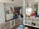 Expansive open-concept living space with hardwood flooring, a staircase, fireplace, and ample natural light at 6824 W Philadelphia Dr, McCordsville, IN 46055