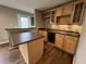 Home bar featuring granite countertops, a beverage fridge, and glass front cabinets at 6924 Havenmoor Pl, Indianapolis, IN 46250