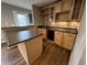 Charming home bar featuring sleek countertops, wine rack, cabinets, mini-fridge, and modern backsplash at 6924 Havenmoor Pl, Indianapolis, IN 46250