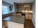 Charming home bar featuring sleek countertops, wine rack, cabinets, mini-fridge, and modern backsplash at 6924 Havenmoor Pl, Indianapolis, IN 46250