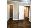 Bedroom with fresh paint, new hardwood floors, and a closet at 6924 Havenmoor Pl, Indianapolis, IN 46250