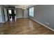 Dining room with lovely flooring, modern chandelier, and natural light from the large window at 6924 Havenmoor Pl, Indianapolis, IN 46250