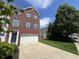 Two-story brick home featuring an attached garage and a well-maintained front lawn at 6924 Havenmoor Pl, Indianapolis, IN 46250