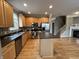Bright kitchen featuring a center island, stainless steel appliances, and light wood cabinetry at 6924 Havenmoor Pl, Indianapolis, IN 46250