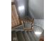 Carpeted staircase with white risers and wood railing at 6924 Havenmoor Pl, Indianapolis, IN 46250